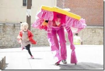 Curious Alice - Alice in Wonderland on Stilts - Walkabout photo by Adrian Cassidy for the Story Museum Oxford