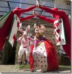 Curious Alice - Alice in Wonderland on Stilts - Walkabout photo by Adrian Cassidy for the Story Museum Oxford